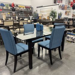 5 Piece dining Set / Includes: 72” Glass table and 4 chairs. 