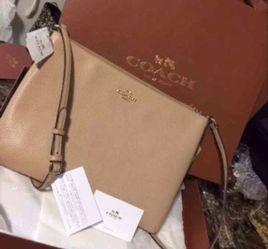 Authentic coach cross body bag comes with dust and shopping bag