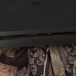 ps4 with the games on it and controller 