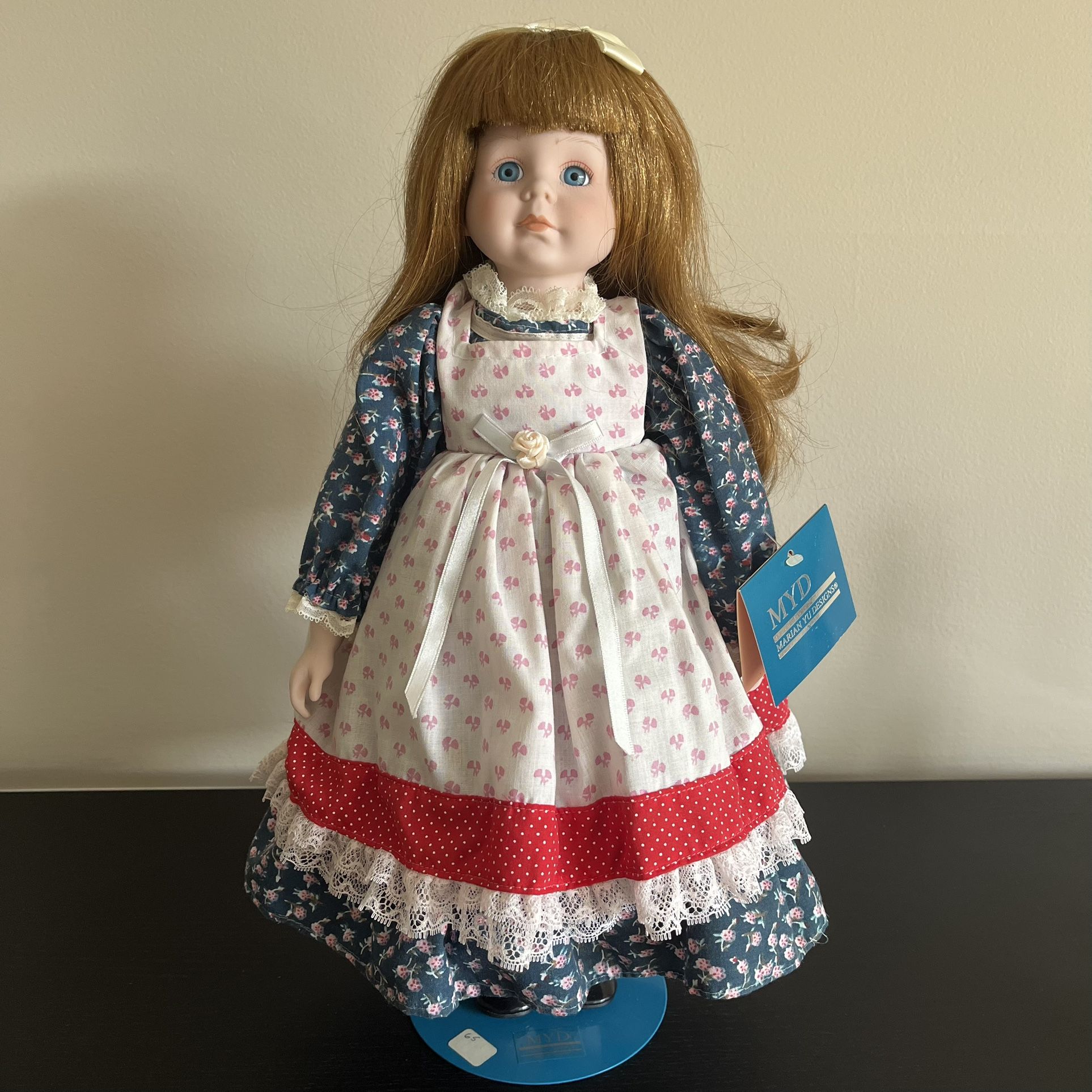 Vintage 1989 MYD Marian Yu Designs 16” Bisque Porcelain Doll. She stands gracefully with the assistance of her original display stand. This porcelain