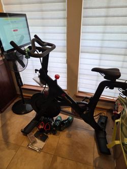 Pelaton bike, mat, shoes, ear buds, heart rate monitor