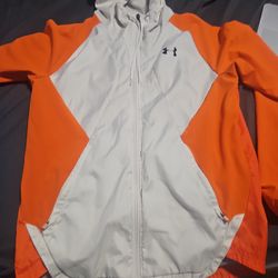 UA Team Legacy Windbreaker Jacket in white and orange.