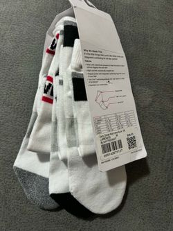 Lululemon Daily Stride Mid-Crew socks in a black, heather grey, and white striped colorway