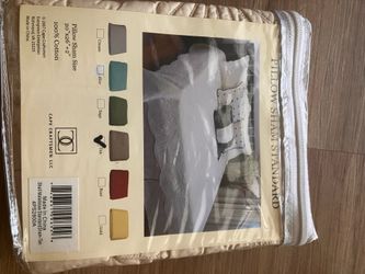 New quilted pillow sham in original package.