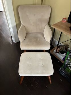 Cushioned chair with foot stool