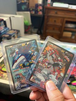 Team Aqua's Kyogre EX & Team Magma's Groudon EX Pokemon Cards