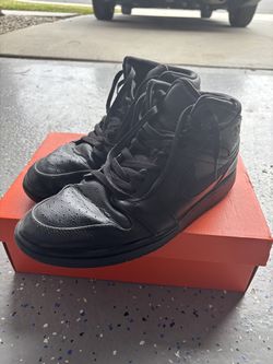 Mid black Air Jordan 1s