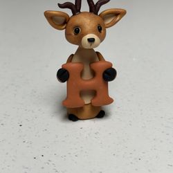 Light Brown Deer Holding “h”