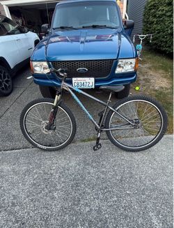 2 mountain bikes redline cog and Marin east peak
