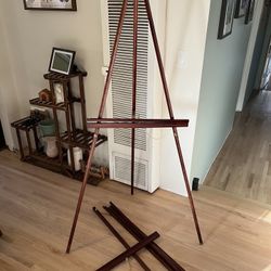 Two large easels, approximately 5’ cherry finish