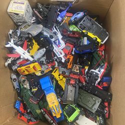 Box Of Cars, Trucks, And Planes.