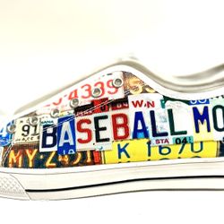 These canvas sneakers feature a unique "license plate graffiti" design customized with the words "BASEBALL MOM". They are low-top, handcrafted shoes t