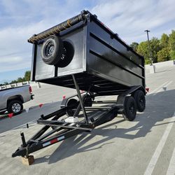 NEW DUMP TRAILER 8X12X4 12000 LBS
ROLLING TARP--SPARE TIRE,ELECTRIC BRAKES,HYDRAULIC SYSTEM,REMOTE CONTROL,IDEAL FOR HAULING, DEMOLITION, TRASH ETC,