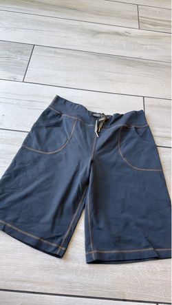 dark grey athletic Bermuda-length shorts