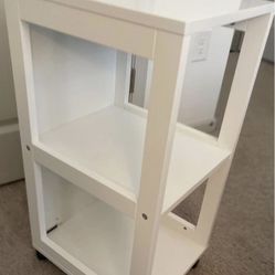 small book shelf with tire  color white 