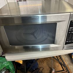 This is a KitchenAid stainless steel countertop microwave