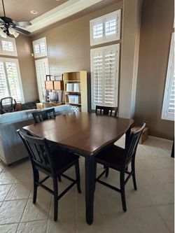 Counter height dining table set with 4 chairs.