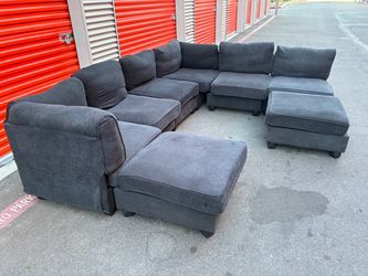 Large Dark Gray Modular Sectional Sofa with Ottomans