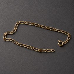 Pulsera Figaro de oro 18K delicada y elegante