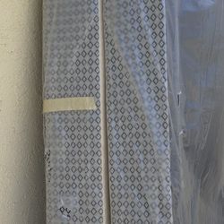 The mattress boxes can be used for a California king-size bed or a long twin bed.