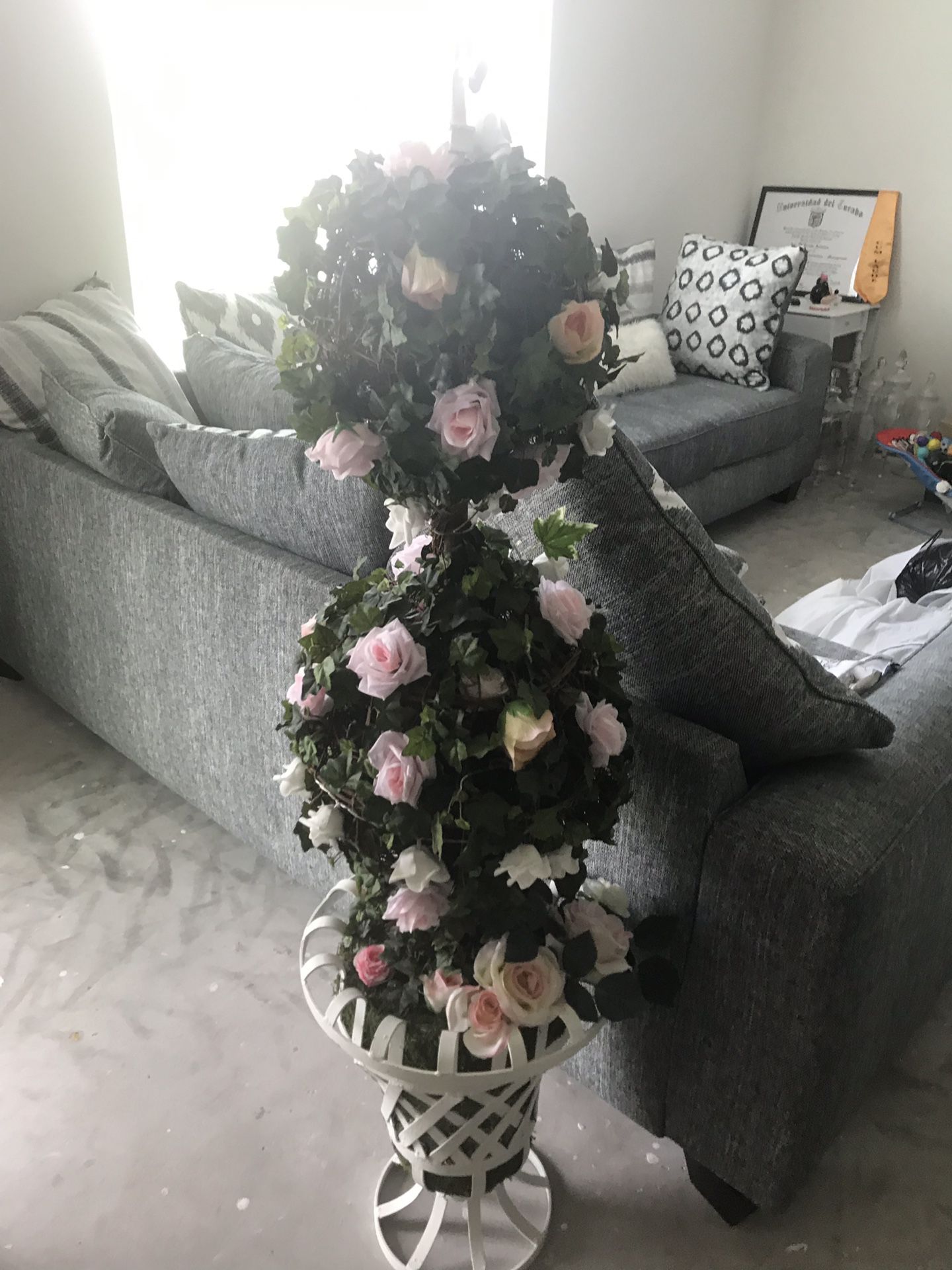 Three tier flower stand with white vase