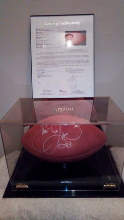 Authentic hand sighed emmitt Smith football in mirrored display case with JSA letter of authenticity