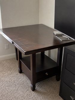 Dark Wood Drop-Leaf Dining Table with Storage