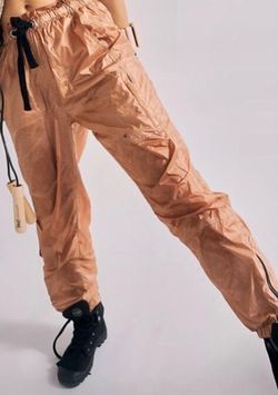 Woman’s large gold cargo zipper at bottom side back to the future pants by free people movement