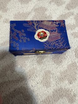 Traditional Chinese iron balls (Baoding balls) in original decorative case.