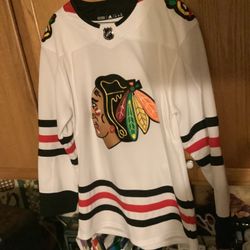 Chicago Blackhawks official Addidas white jersey size 44 in mint condition. Stitched, no snags or stains This is authentic, featuring Adidas moisture 