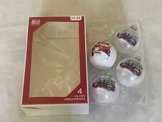 Boxed set of four Holiday Time glass ornaments.