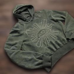 Muted green hoodie with a detailed embroidered eye 
