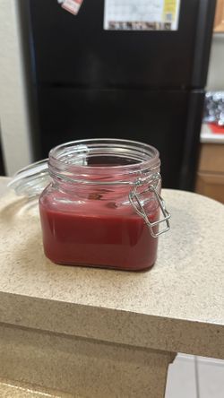 Woodwick Candle In A Clear Container With Lid.
