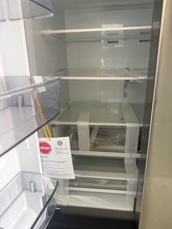 lg refrigerator new 36 width unit has dent door