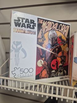 Buffalo Games Star Wars: The Mandalorian 500-piece jigsaw puzzle featuring artwork titled "The First Thrilling Chapter".
