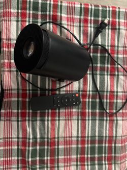 4K projector with remote and 100 inch screen.