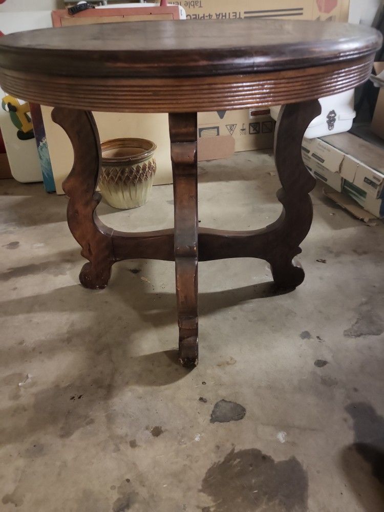 Ornate allwood round antique table $250 OBO