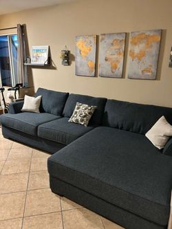 Beautiful and comfortable dark blue sectional couch with extra wide chaise fromJerome’s
