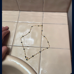 Women’s gold and stone necklace