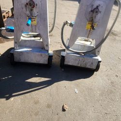 Two 2-way manual fryer oil pumps on wheels