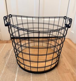 Black metal basket with wood bottom
