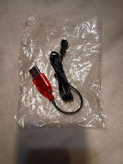 USB - to battery charging cable commonly used for small electronics and remote - controlled toys.