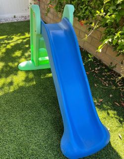 Little Tikes Easy Store playground slide features a blue sliding surface and green suppor