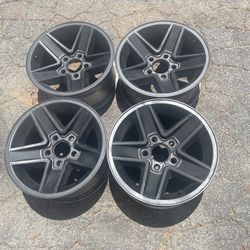 Four Chevy Camaro 15x7 inch black rims 5 on 4.75. Fits S10 and GM cars 