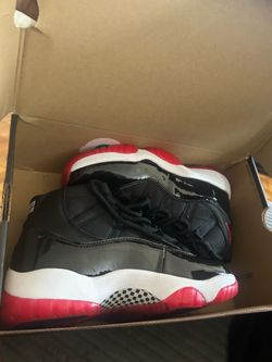 NEW JORDAN BRED 11 SIZE 6Y,7Y