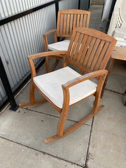 Two rocking wooden chairs