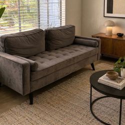 Modern grey sofa. Can deliver.