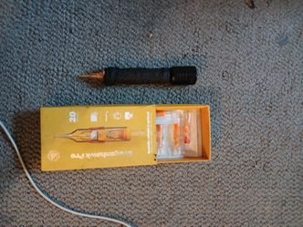 Portable  tattoo  machine and needles