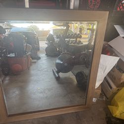 Walnut colored wooded frame mirror