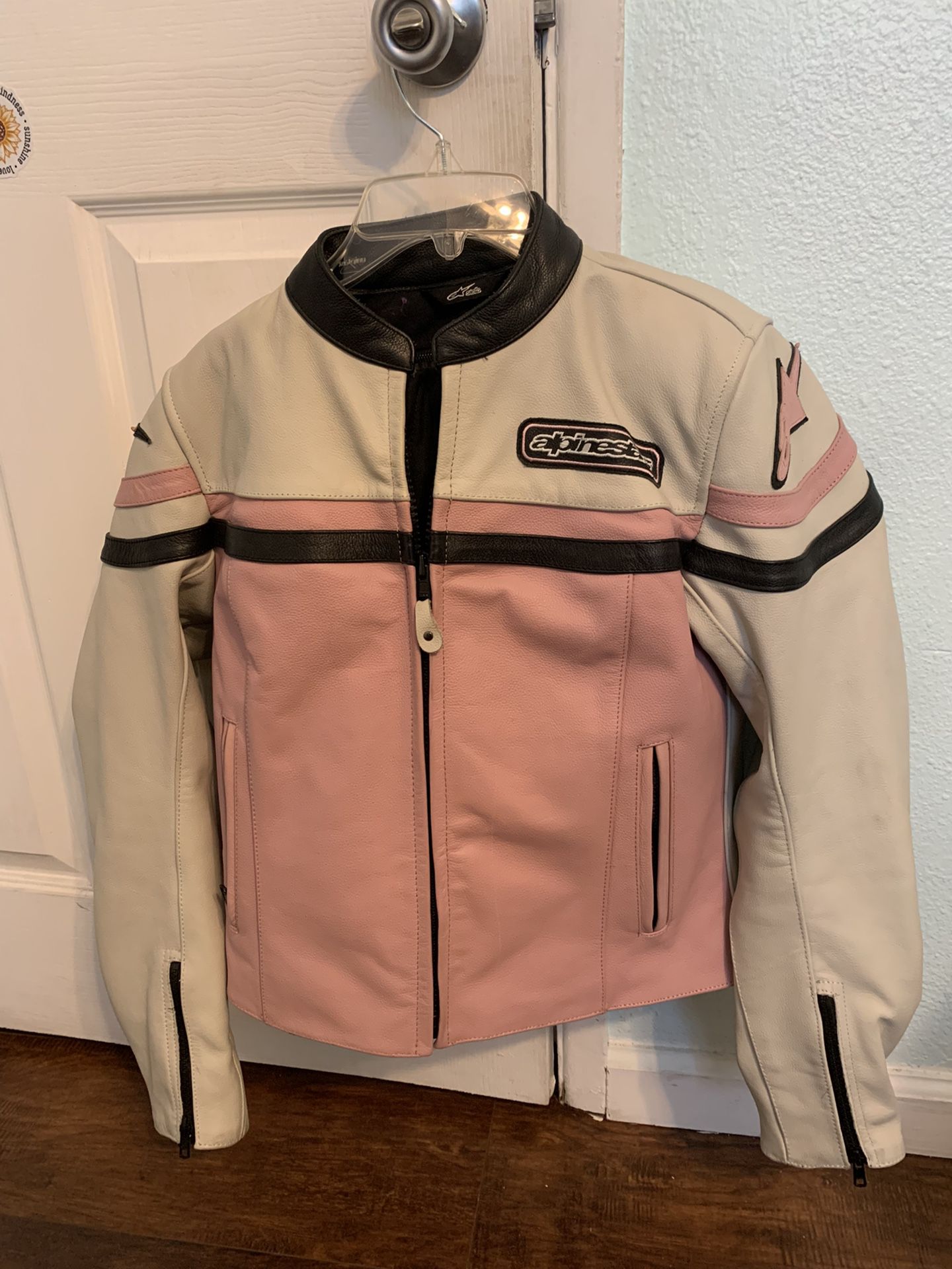 Alpinestars Stella Womens Pink/White/Black Leather Motorcycle Jacket. Size 6. Padding on shoulders and elbows. Gently used condition, no flaws, no rip